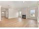 Spacious living room with hardwood floors, natural light, and a cozy fireplace at 1818 Winding Mist Dr, Belmont, NC 28012