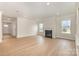 Bright living room showcases a cozy fireplace and expansive hardwood floors at 1818 Winding Mist Dr, Belmont, NC 28012