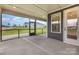 Relaxing screened patio with neighborhood views and door access to the home's interior at 1818 Winding Mist Dr, Belmont, NC 28012