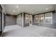 Covered screened patio with a view of the backyard perfect for outdoor entertaining at 1818 Winding Mist Dr, Belmont, NC 28012