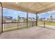 Covered screened porch offering serene outdoor living space with neighborhood views at 1818 Winding Mist Dr, Belmont, NC 28012