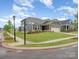 Street view of a single-Gathering home with neutral siding, a well-kept lawn and a two car garage at 1818 Winding Mist Dr, Belmont, NC 28012