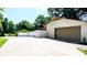 A spacious driveway leading to an attached garage and a fenced backyard on a sunny day at 201 Forest Rd, Taylorsville, NC 28681