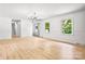 Open-concept living room with lots of natural light and gray wood-style flooring at 201 Forest Rd, Taylorsville, NC 28681