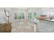 Sunlit breakfast nook featuring tile flooring and multiple windows, next to kitchen at 201 Limerick Dr, Matthews, NC 28104
