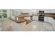Spacious kitchen featuring white cabinetry, granite countertops, stainless steel appliances, and tile flooring at 201 Limerick Dr, Matthews, NC 28104