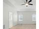 Bright main bedroom with tray ceiling, ceiling fan, and ensuite bath, creating a relaxing retreat at 201 Limerick Dr, Matthews, NC 28104