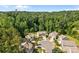 Aerial view of the neighborhood showing well-maintained homes and lush trees at 2021 Tarzi Ln, Charlotte, NC 28215