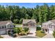 Inviting two-story home with a two-car garage, surrounded by lush greenery in a peaceful neighborhood at 2021 Tarzi Ln, Charlotte, NC 28215