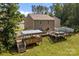 Enjoy a spacious backyard with a deck, grill, and entertainment space at 2021 Tarzi Ln, Charlotte, NC 28215