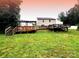 Expansive backyard featuring a multi-tiered wooden deck, perfect for outdoor entertaining and relaxation at 2021 Tarzi Ln, Charlotte, NC 28215