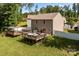 Expansive backyard with a spacious wooden deck, seating area, and lush green lawn, perfect for outdoor enjoyment at 2021 Tarzi Ln, Charlotte, NC 28215