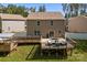 Spacious backyard featuring a large deck with lounge seating, perfect for outdoor entertaining and relaxation at 2021 Tarzi Ln, Charlotte, NC 28215