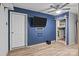 Finished basement area is complete with ceiling fan and lots of open space at 2021 Tarzi Ln, Charlotte, NC 28215