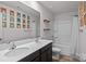 Bathroom featuring double sinks, framed art, and a shower with a curtain at 2021 Tarzi Ln, Charlotte, NC 28215