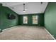 This bedroom features natural light and a ceiling fan at 2021 Tarzi Ln, Charlotte, NC 28215