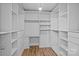 A walk-in closet offers an abundance of storage with custom shelving at 2021 Tarzi Ln, Charlotte, NC 28215