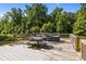 Relax outdoors on this spacious deck featuring comfortable seating and views of the backyard at 2021 Tarzi Ln, Charlotte, NC 28215