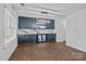 Contemporary dining area featuring stylish cabinets, a wine fridge, and modern lighting, creating a sophisticated ambiance at 2021 Tarzi Ln, Charlotte, NC 28215