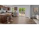 Eat-in kitchen with dark wood cabinetry, granite counters, stainless appliances, and sliding doors to deck at 2021 Tarzi Ln, Charlotte, NC 28215