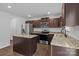 Kitchen featuring stainless steel appliances, dark cabinets, granite countertops, and a center island at 2021 Tarzi Ln, Charlotte, NC 28215