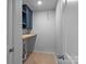 Laundry Room with wood floors and cabinets at 2021 Tarzi Ln, Charlotte, NC 28215