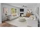 Spacious living room with neutral walls, modern fireplace, updated lighting, and stylish decor at 2021 Tarzi Ln, Charlotte, NC 28215