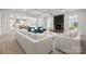 Inviting living room with a fireplace, coffered ceiling, and an open layout to the kitchen and dining area at 203 Balboa St, Matthews, NC 28104
