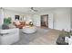 Spacious living room featuring modern furniture, a view to staircase, and stylish decor, ideal for entertaining at 203 Balboa St, Matthews, NC 28104