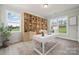 Bright office featuring a large window, modern desk, and stylish built-in bookcase at 203 Balboa St, Matthews, NC 28104