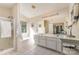 Bright bathroom featuring a double vanity, walk-in shower, and soaking tub with a window view at 2206 Waters Trail Dr, Charlotte, NC 28216