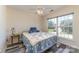 Comfortable bedroom with a large window providing natural light and a charming quilt on the bed at 2206 Waters Trail Dr, Charlotte, NC 28216