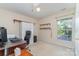Functional bedroom currently used as a home office, featuring built-in shelves and a large window at 2206 Waters Trail Dr, Charlotte, NC 28216