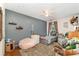 Cozy bedroom with colorful star accents on the ceiling, a beanbag, and plentiful stuffed animals at 2206 Waters Trail Dr, Charlotte, NC 28216