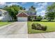 Charming two-story home with brick facade, manicured lawn, and attached two car garage at 2206 Waters Trail Dr, Charlotte, NC 28216