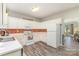 Efficient kitchen with white cabinets, stainless steel sink, and decorative backsplash at 2206 Waters Trail Dr, Charlotte, NC 28216