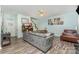 Comfortable living room with wood-look floors, a sectional sofa, natural light and a staircase at 2206 Waters Trail Dr, Charlotte, NC 28216