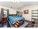 Spacious main bedroom featuring hardwood floors, a comfortable bed, and ample natural light at 2206 Waters Trail Dr, Charlotte, NC 28216