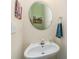 Charming powder room with a round mirror and a stylish vanity with a soap dispenser at 2206 Waters Trail Dr, Charlotte, NC 28216