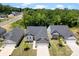 An aerial view displays a neighborhood of houses and surrounding green trees at 2217 Goldwood Dr, Charlotte, NC 28215