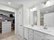 Bathroom features double sinks and a walk-in closet, creating an efficient and stylish space at 2217 Goldwood Dr, Charlotte, NC 28215