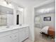 Bright bathroom boasts double sinks with modern fixtures and connects seamlessly to a stylish bedroom at 2217 Goldwood Dr, Charlotte, NC 28215