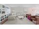 Bright living room with a comfortable white couch, stylish decor, and natural light from the windows at 2217 Goldwood Dr, Charlotte, NC 28215
