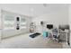 Bright home office featuring large windows, a sit stand desk, and a treadmill. Great for working at home! at 2217 Goldwood Dr, Charlotte, NC 28215