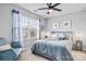 Comfortable bedroom features a cozy bed, a ceiling fan, a chair, and natural light from the window at 2522 Richland Balsam Dr # 450, Fort Mill, SC 29715