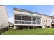 Back of the house featuring a screened-in porch with white railings and ample space for outdoor activities at 2522 Richland Balsam Dr # 450, Fort Mill, SC 29715