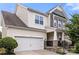 Charming two-story home showcasing stone accents, neutral siding, and an attached two-car garage at 2522 Richland Balsam Dr # 450, Fort Mill, SC 29715