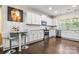 Modern kitchen boasts stainless steel appliances, granite countertops, and sleek white cabinetry at 2522 Richland Balsam Dr # 450, Fort Mill, SC 29715