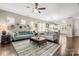 Open-concept living room with hardwood floors and view into the modern kitchen at 2522 Richland Balsam Dr # 450, Fort Mill, SC 29715