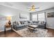 Cozy living room featuring a large sectional sofa, area rug, ceiling fan, and plenty of natural light at 2522 Richland Balsam Dr # 450, Fort Mill, SC 29715